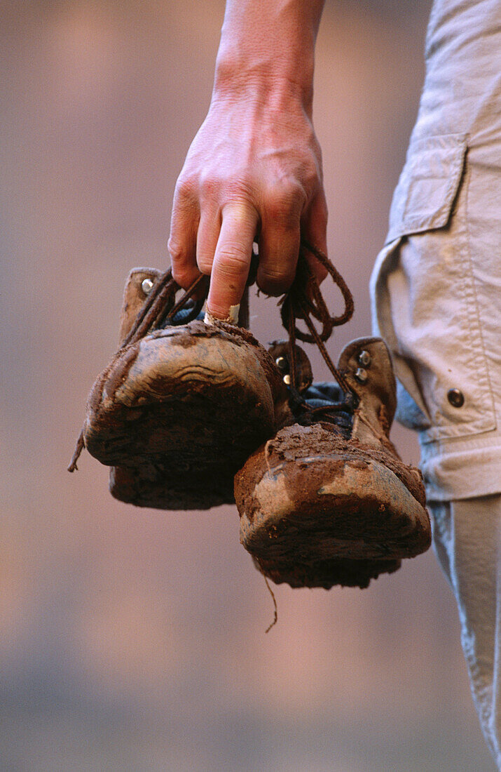 Hiker with muddy boots. Utah, USA