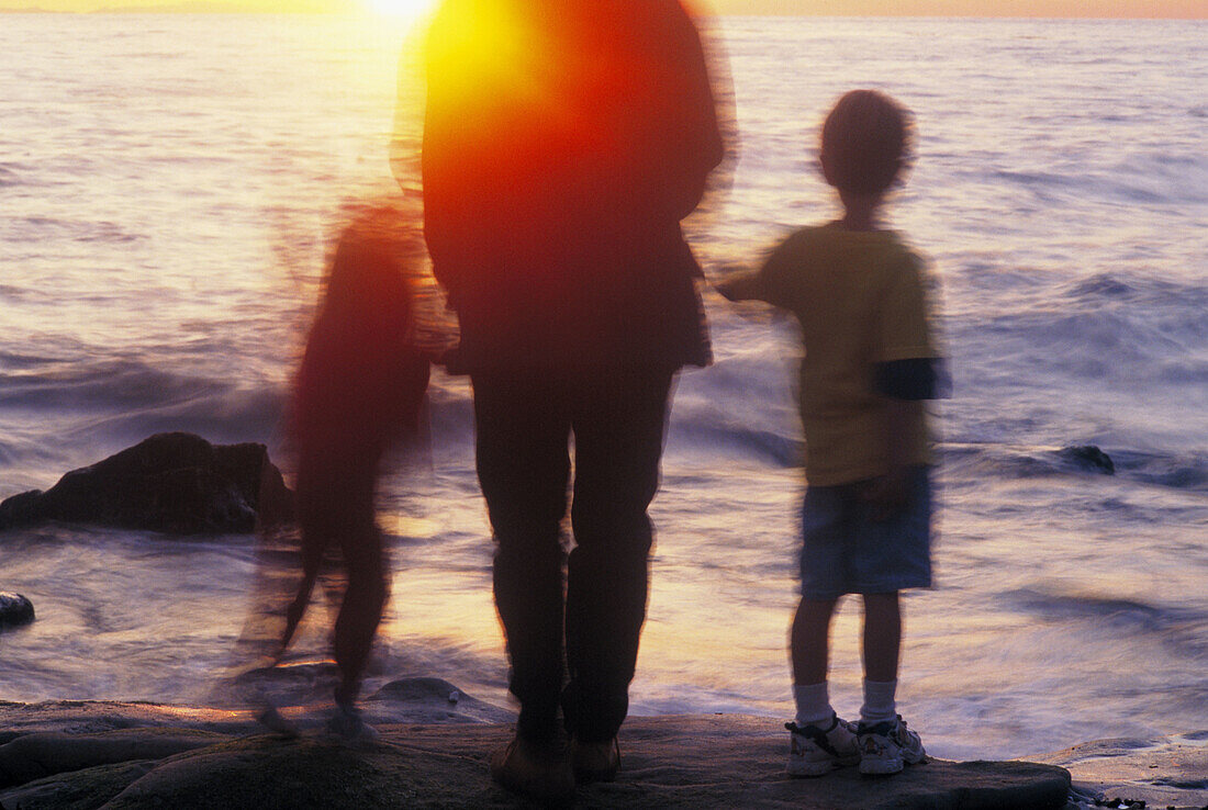 Mother and kids together on beach