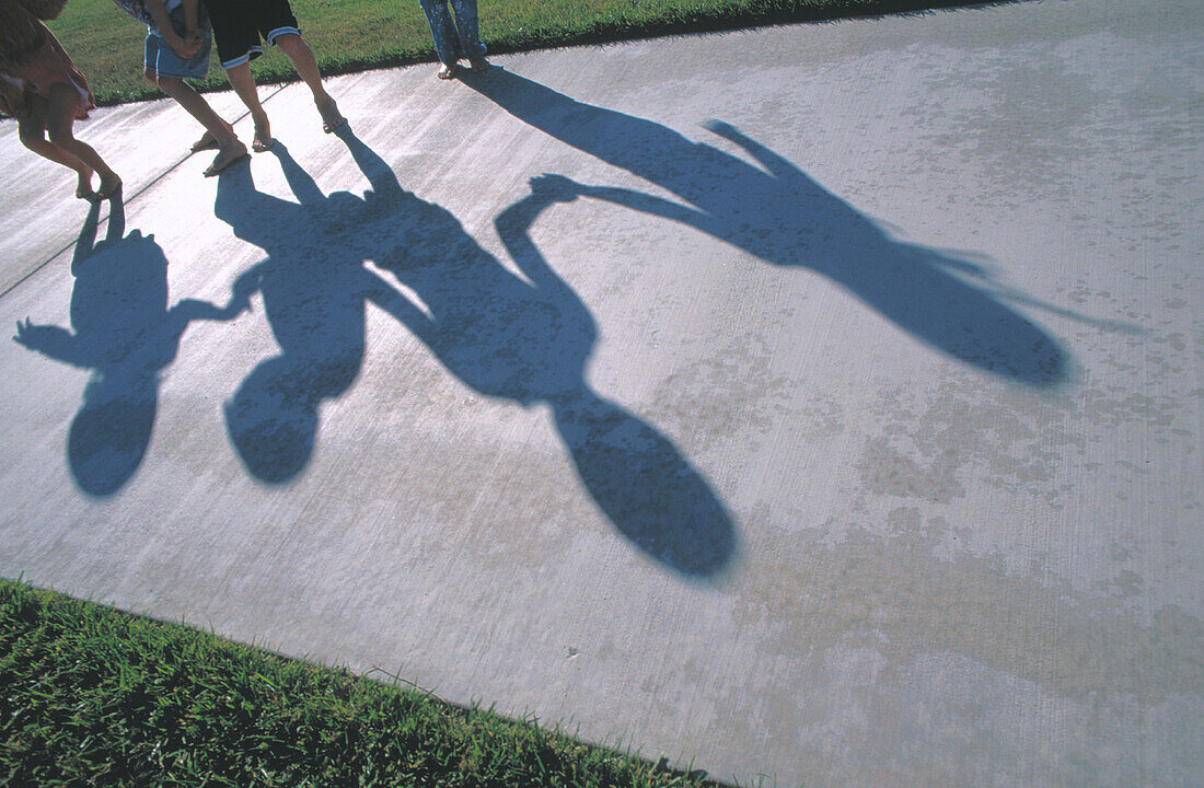 Kids shadows on walking path