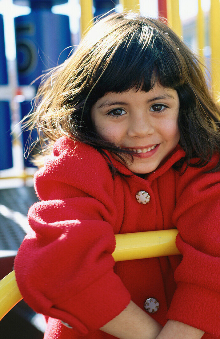 Girl on playground bars
