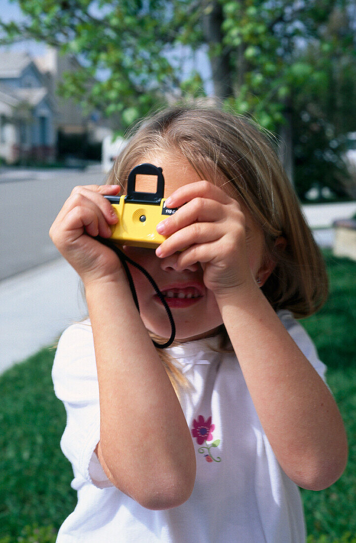 Young girl using her camera