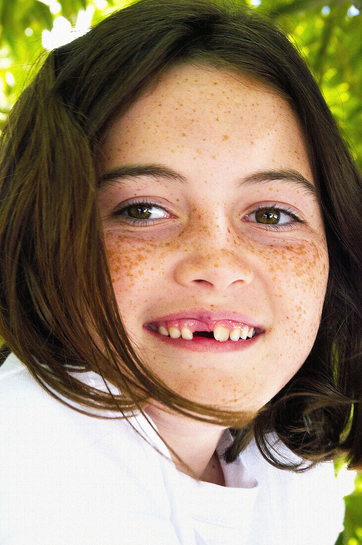 young girl without tooth