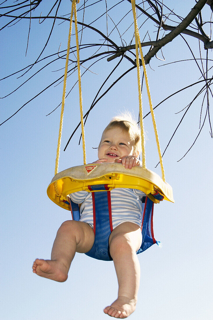 infant on swing