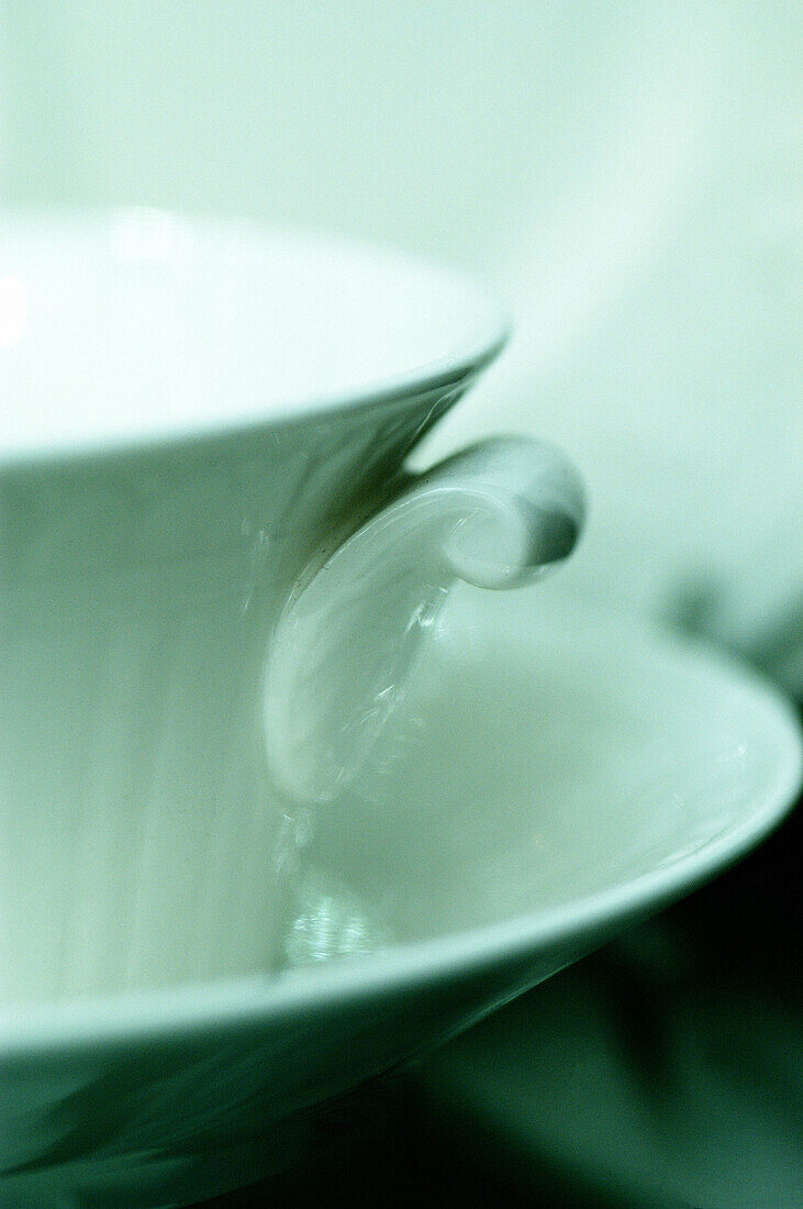  Close up, Close-up, Closeup, Color, Colour, Concept, Concepts, Cup, Cups, Detail, Details, Elegance, Elegant, Handle, Handles, Indoor, Indoors, Inside, Interior, Object, Objects, One, One item, Porcelain, Saucer, Saucers, Still life, Thing, Things, Verti