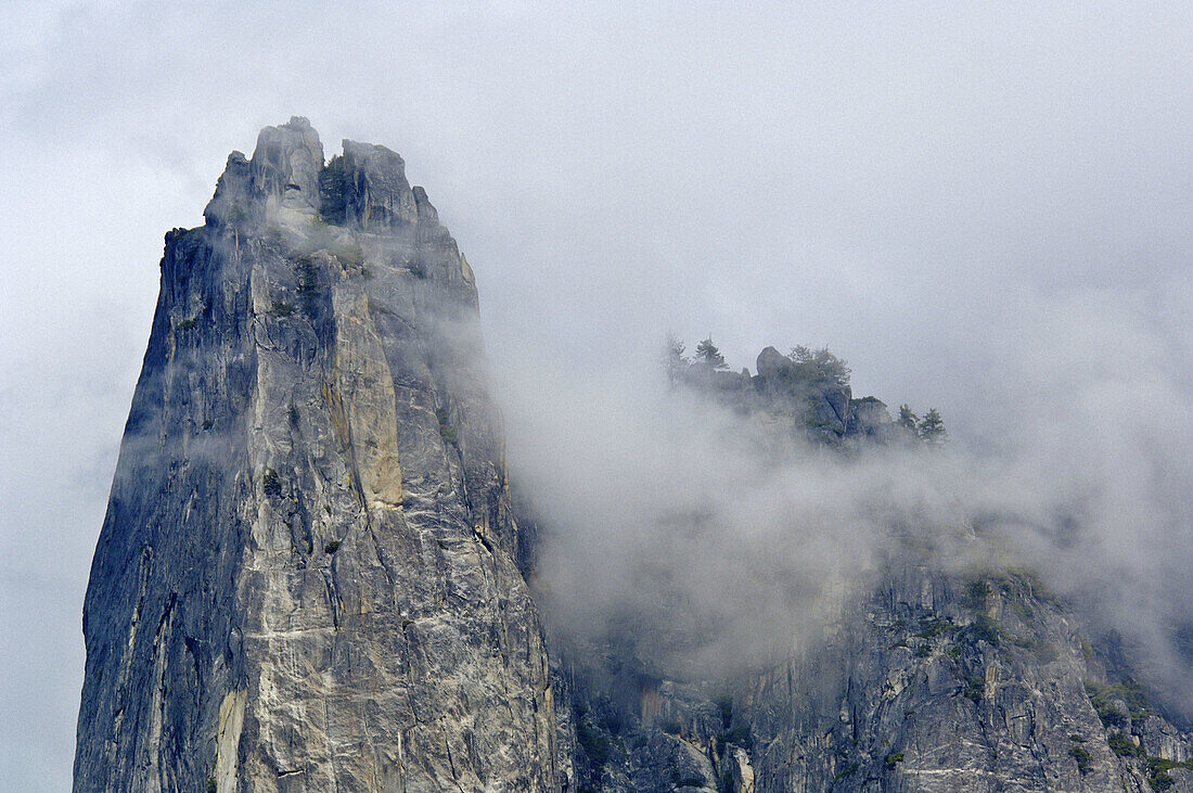 Cloud and granite spire atop Sentinel Rock, Yosemite Valley, Yosemite National Park, California