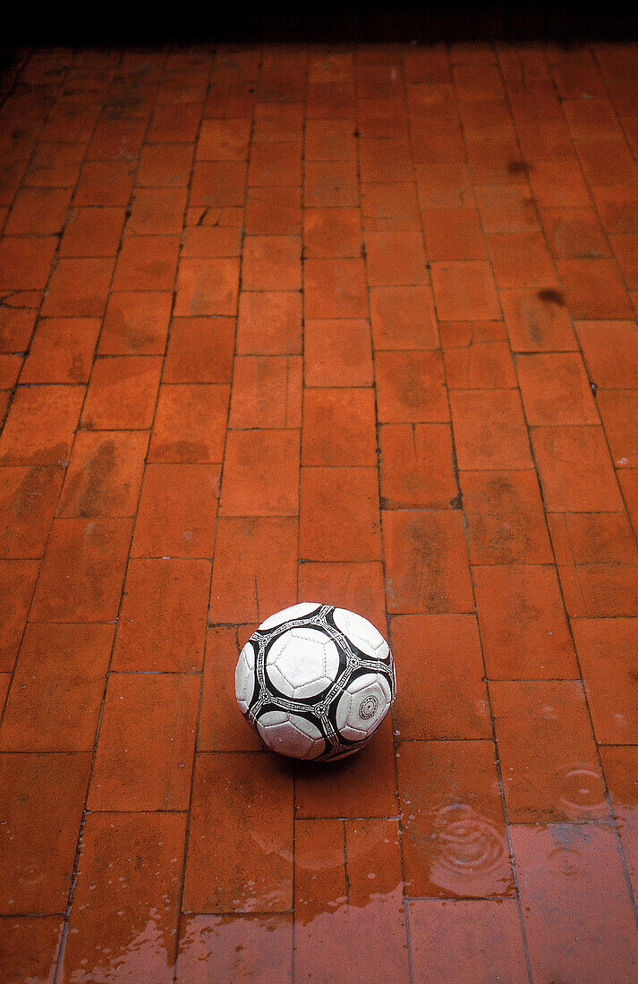 Wet ball and red tiles