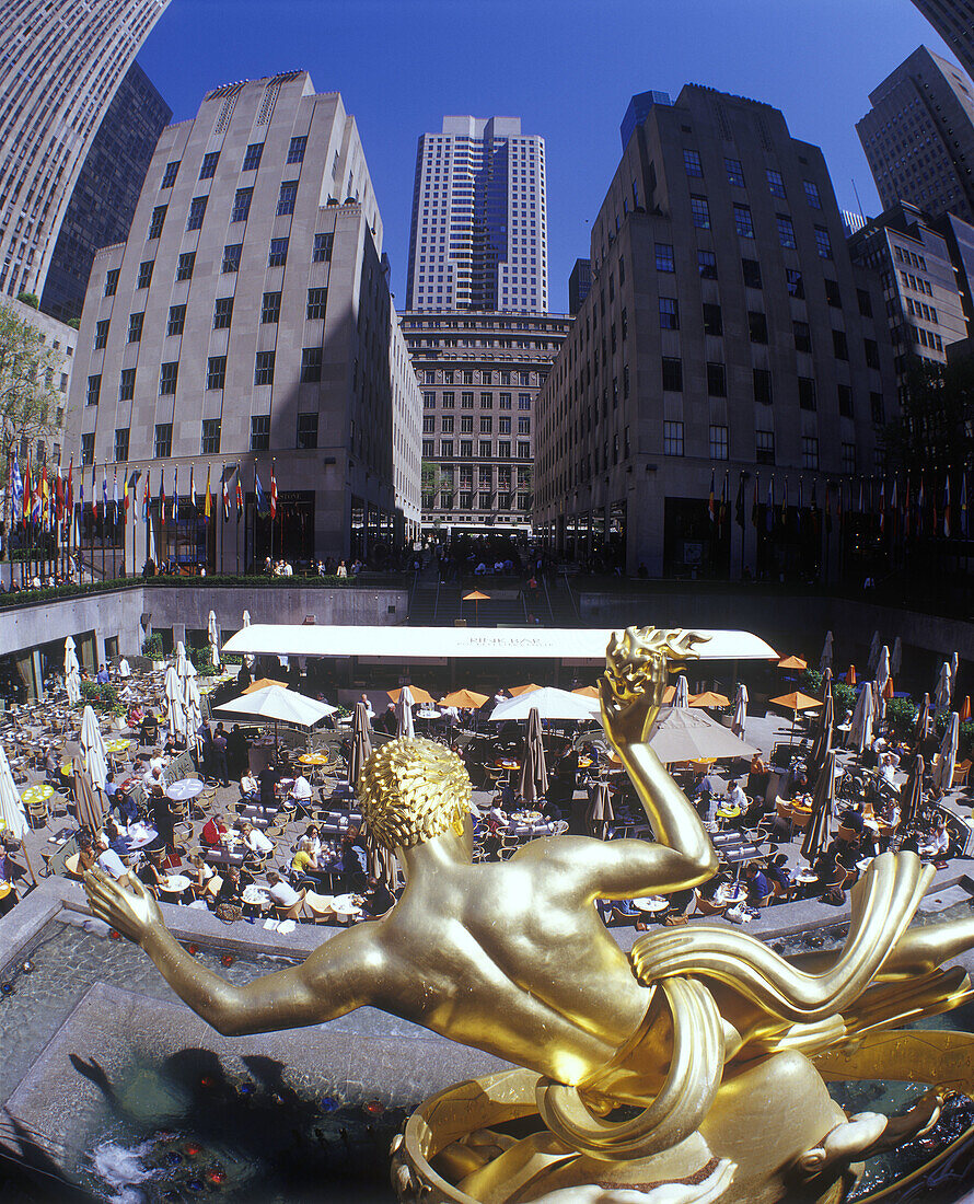 Street scene, Cafes, Prometheus fountain, Rockefeller center, Manhattan, New York, USA.