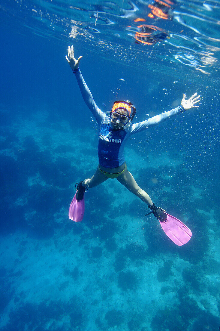 Snorkeller enjoys life at Apo island Marine Reserve, Philippines