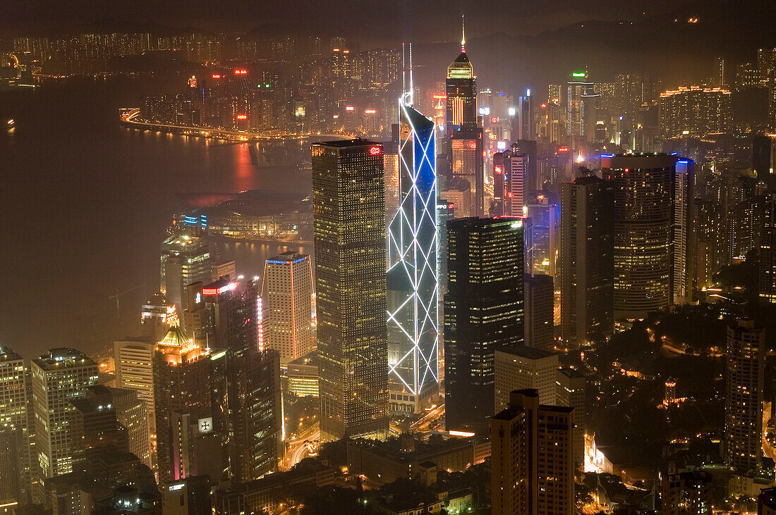 Hong Kong s modern skyline overlooking Victoria harbour and Kowloon peninsula at night, Hong Kong, China