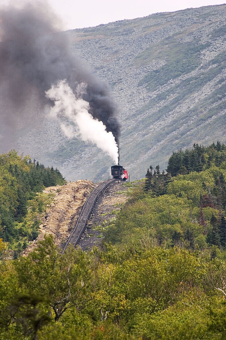 Coal fired steam engine powering the Cog Railway to the summit (elevation 6,288 ft) of Mt. Washington, White Mountains of New Hampshire, USA