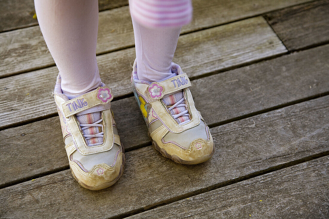 Shoes on the wrong feet of 6 year old girl