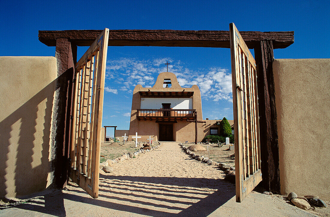 Adobe church and gate. San Ildefonso Pueblo. New Mexico. USA