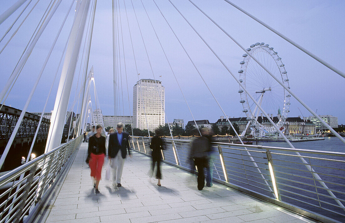 Golden Jubilee Bridge (Hungerford Bridge) over the River Thames. London Eye on the background. London, UK