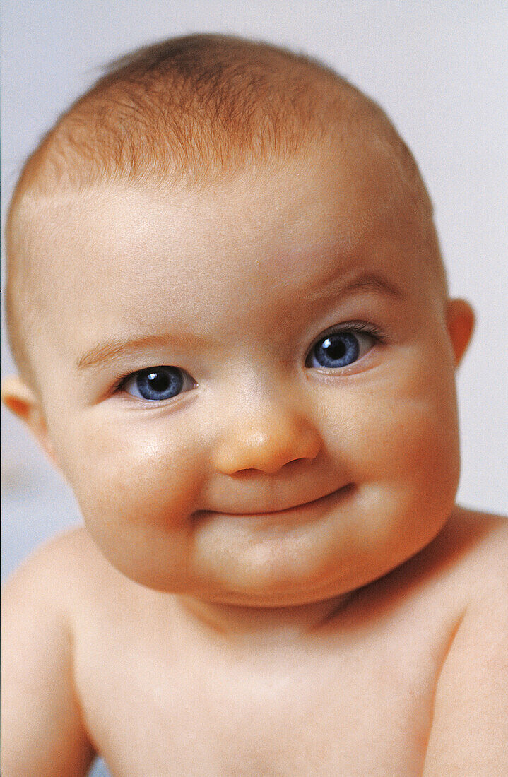 Six-month old boy smiling