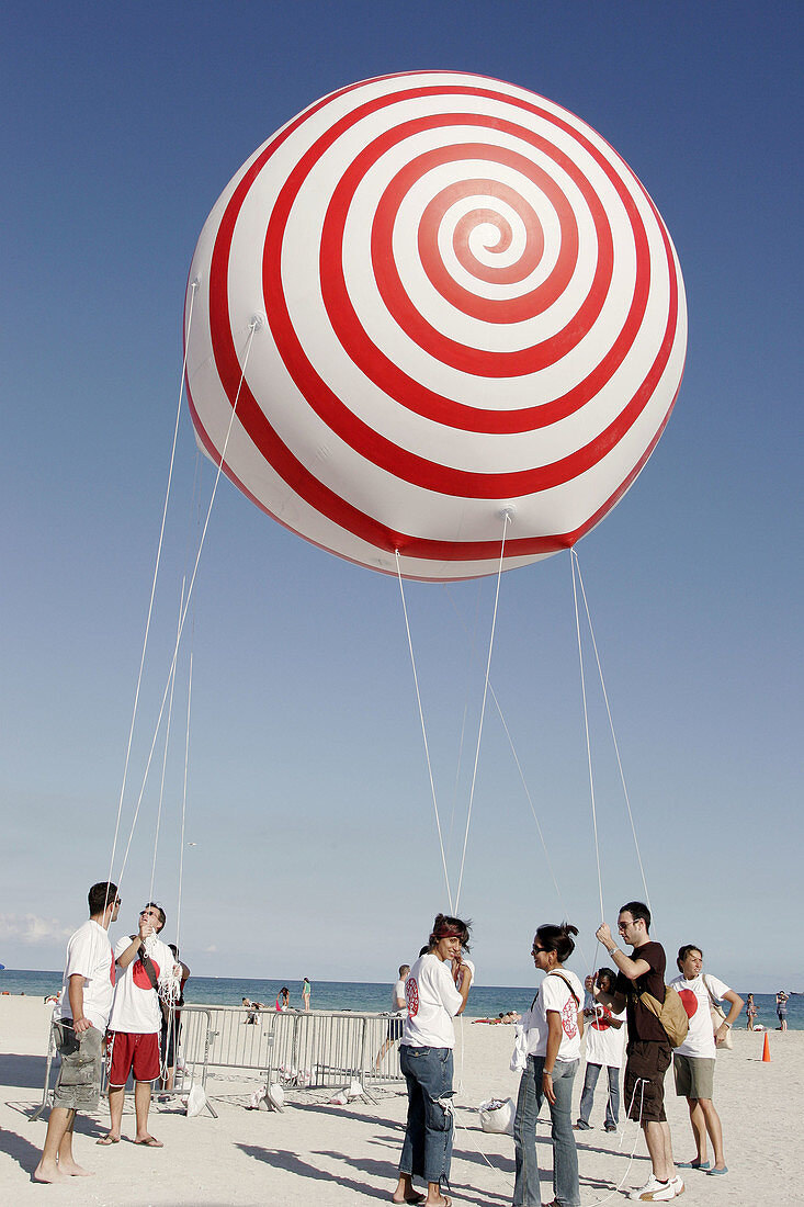 ArtCenter South Florida benefit, volunteers. Skywalkers Giant Blimp Parade. Atlantic Shore. Miami Beach. Florida. USA.