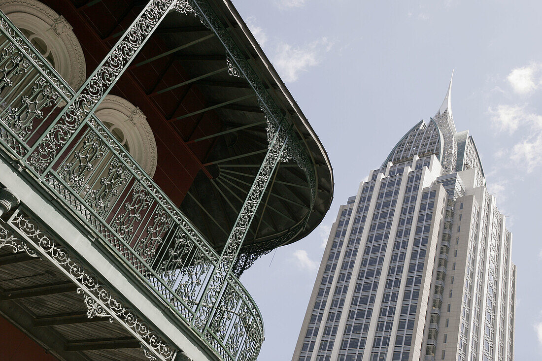 Mobile, Royal Street, Lower Dauphin Historic District, wrought iron railing, balcony, RSA Battle House Tower. Alabama. USA.