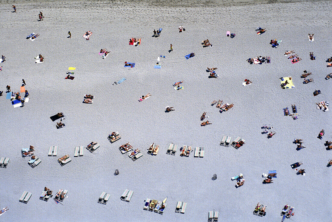 Aerial: sunbathers, Miami beach, Florida, USA.