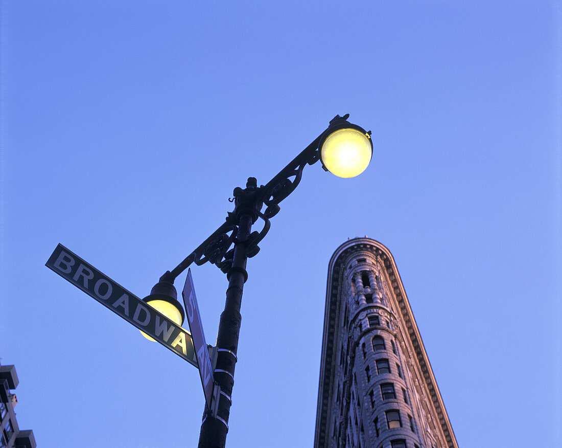 Street scene, Broadway sign, Flatiron building, Manhattan, New York, USA.