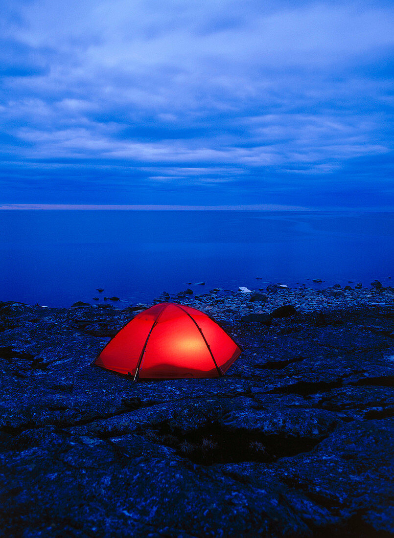 Tent on the seashore in the dusk. Bjuroklubb. Vasterbotten. Sweden