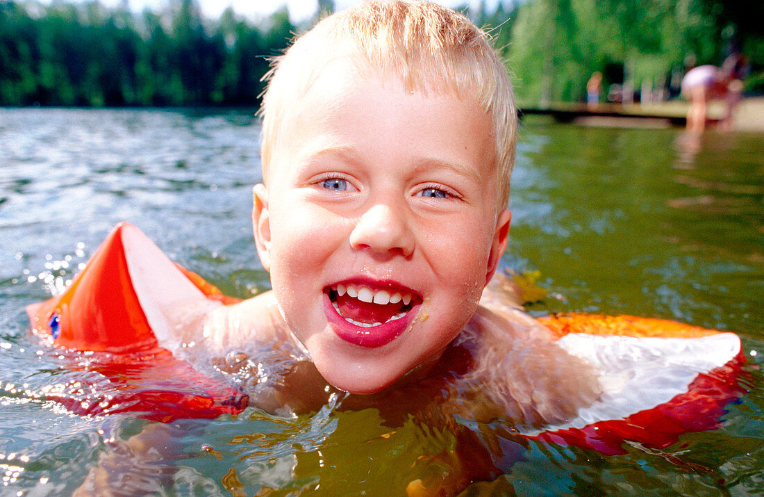 A happy four years boy takes a bath. Medle. Vasterbotten. Sweden