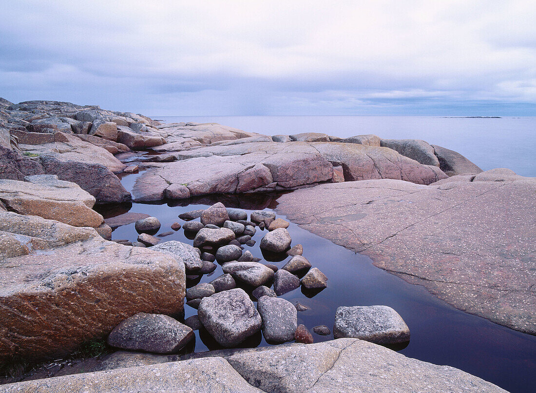 Stones and rocky coastline at dusk. Skag, Ångermanland, Sweden