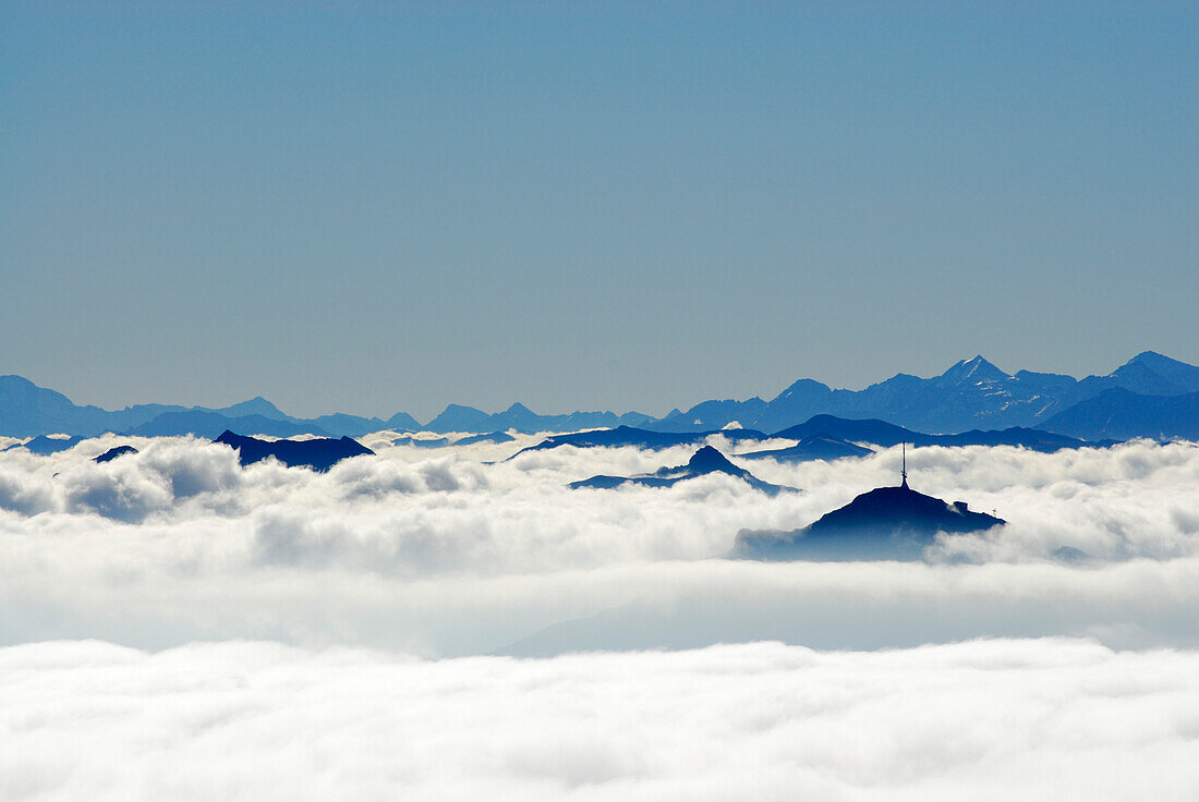 View to Kitzbueheler Horn and Hohe Tauern range above fog bank, Ellmauer Halt, Kaiser range, Tyrol, Austria
