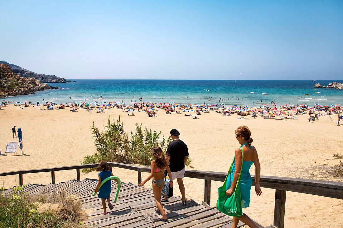 People going downstairs to the beach, Golden Bay, Malta, Europe