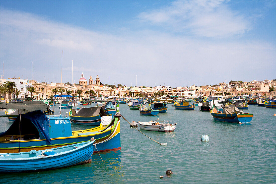 Typical maltese fishing boats at the harbour of Marsaxlokk, Malta, Europe