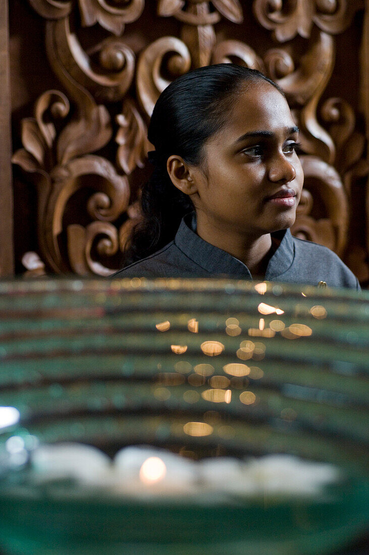 Young woman in the Spa reception, One & Only Resort Reethi Rah, Maldives