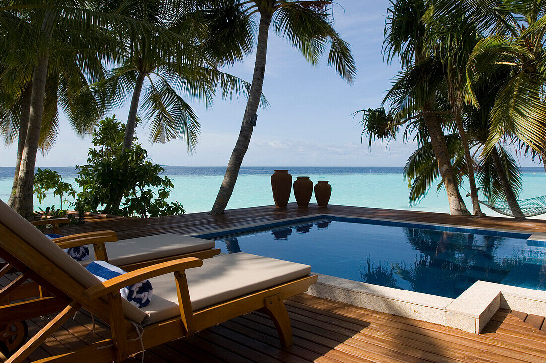 Two deck chairs by the pool, Luxury vacation on a private island, Rania Experience, Faafu Atoll, Maldives