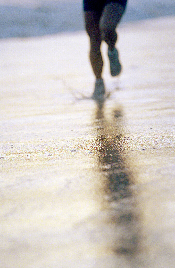 35 years old woman running on beach. California. USA.