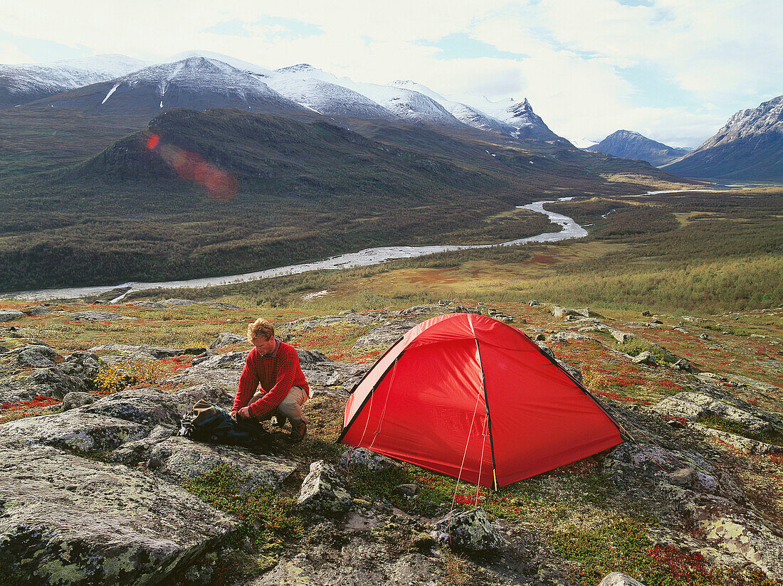 Man and tent. Sarek National Park. Lapland. Sweden