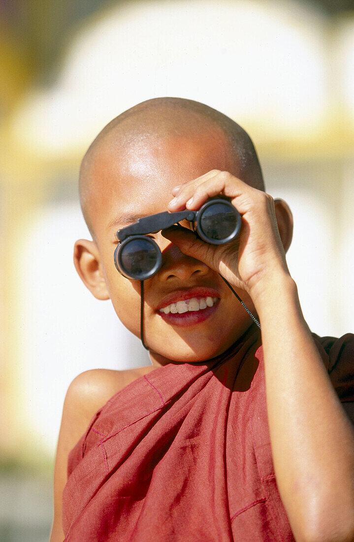 Child monk portrait. Kyaik-Tiyo Pagoda (The Golden Rock). Kyaikto. Myanmar (Burma).