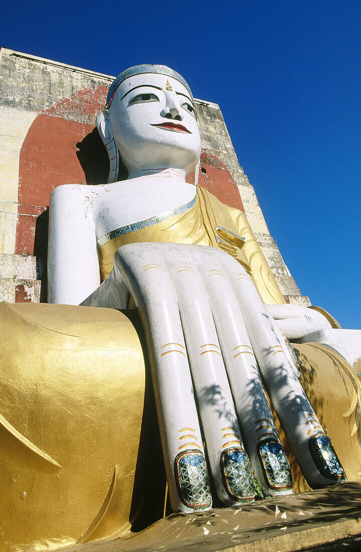 Giant Buddha at Kyaikpun Pagoda. Bago (Pegu). Myanmar (Burma).