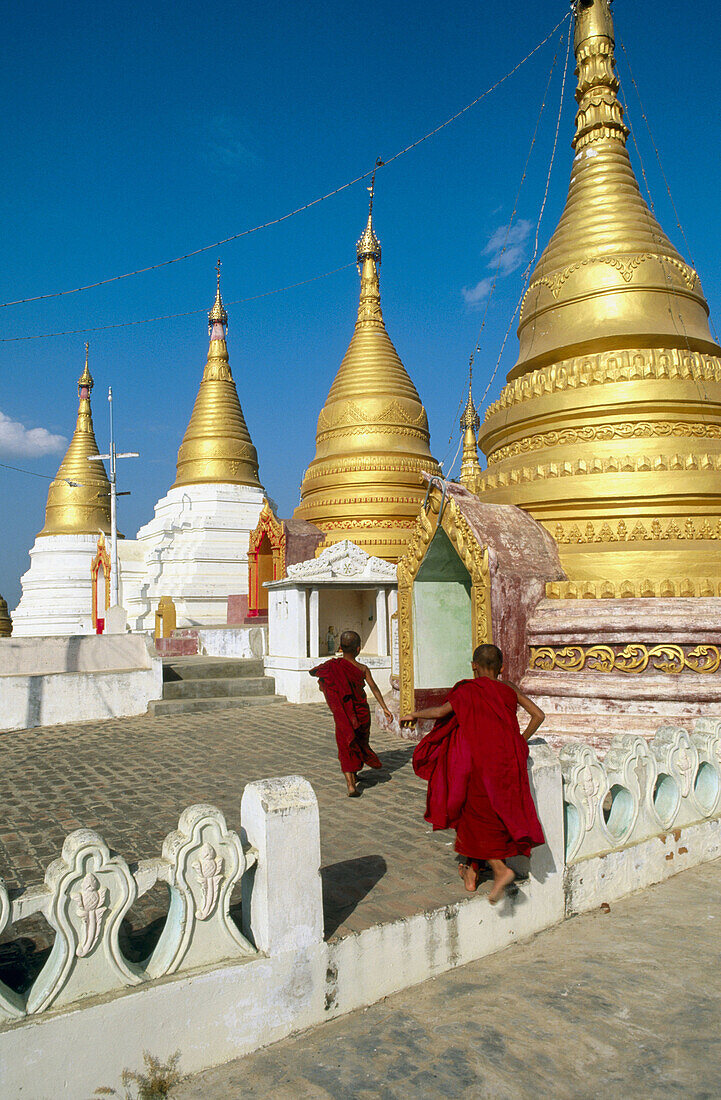 Novice monks in Buddhist pagoda. Mandalay. Myanmar (Burma).