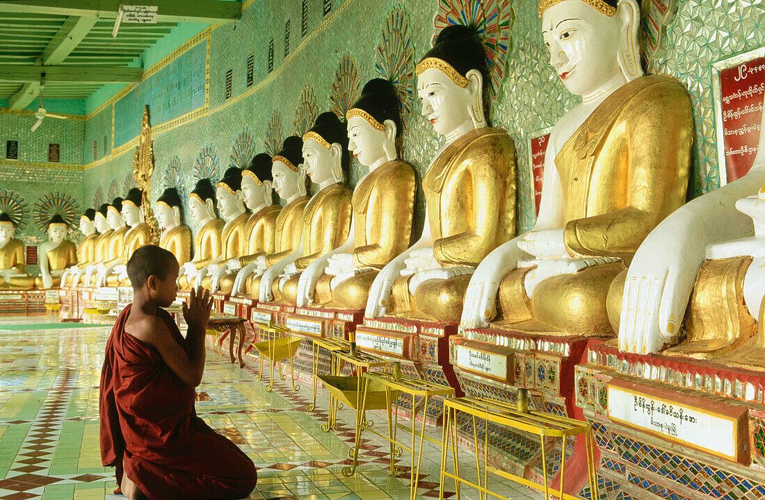 Novice monk at U-Min Thonze Pagoda. Sagaing. Mandalay. Myanmar (Burma).