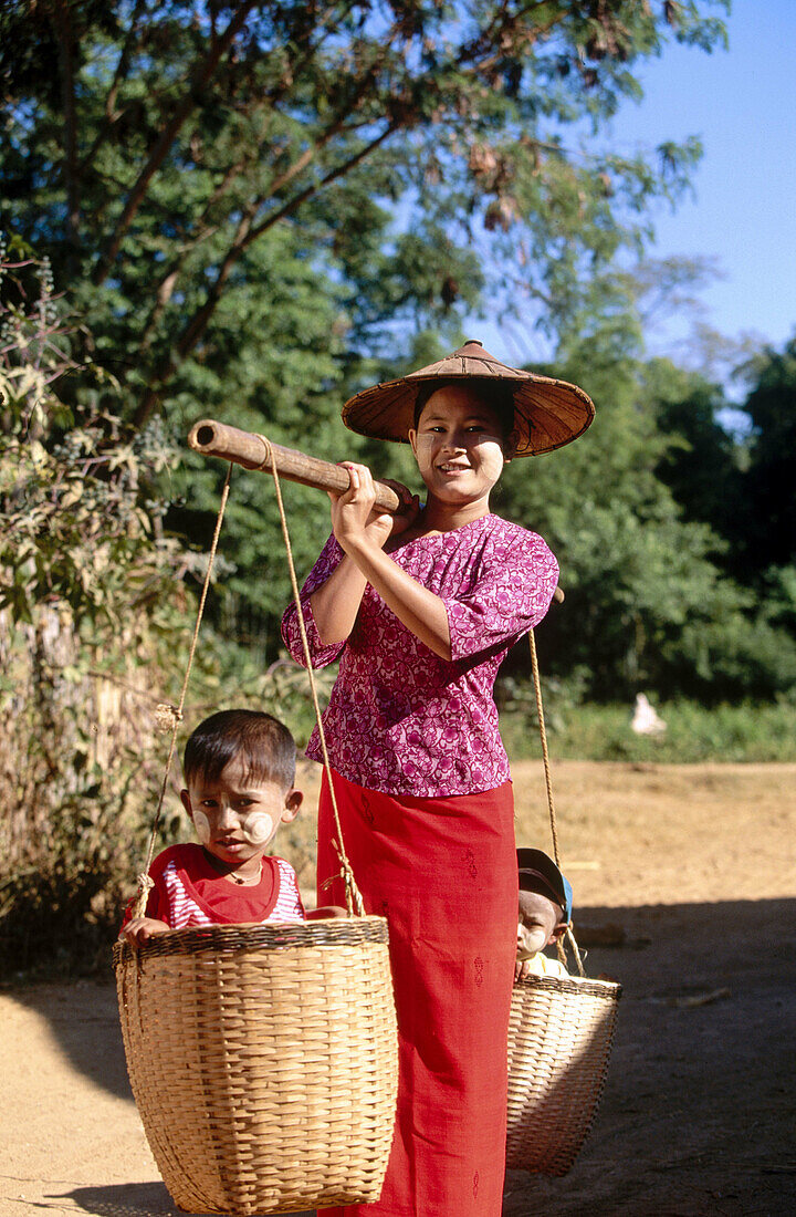 Woman with children. Inden village. Inle Lake. Shan State. Myanmar.