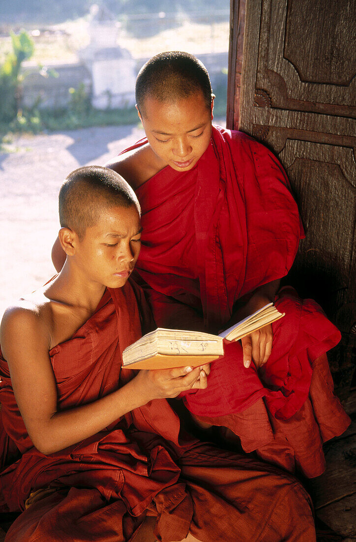 Monks in wood monastery. Inle Lake. Shan State. Myanmar.