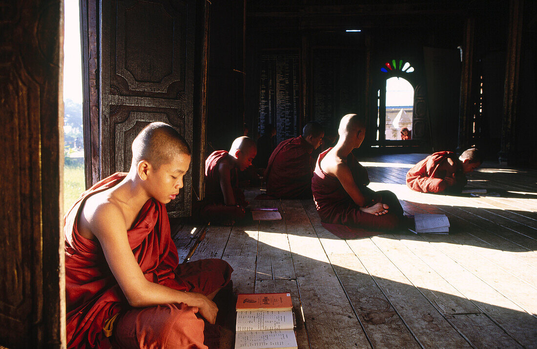 Monks in wood monastery. Inle Lake. Shan State. Myanmar.