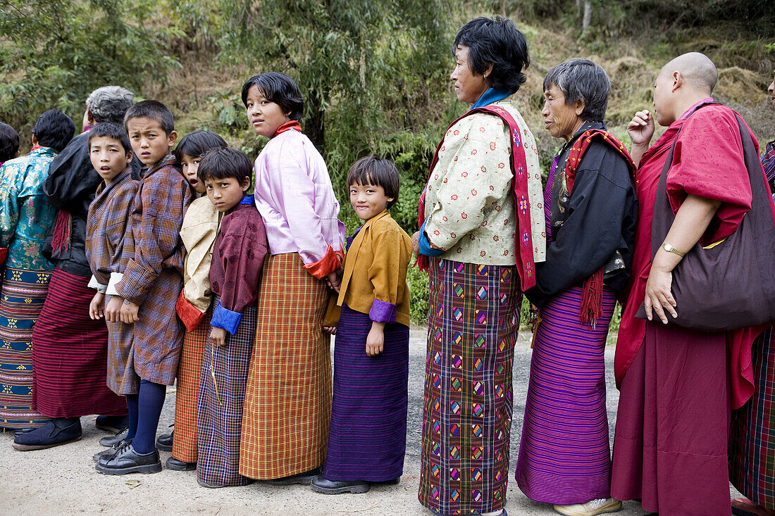 Bhutan. Trongsa. People waiting to enter Trongsa Dzong Monastery for religious festival.