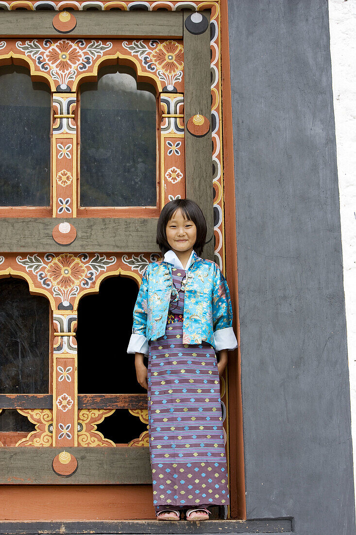 Bhutan. Thimpu. Thimpu Dzong Monastery. Buddhist Festival (Tsechu). Bhutanese little girl.