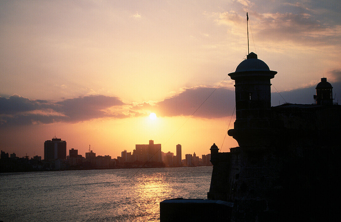 Fortress of El Morro at sunset and Havana in background. Cuba