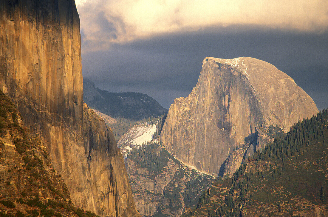 Late afternoon light on Half Dome and El Capitan under storm clouds, Yosemite Valley, Yosemite National Park, California