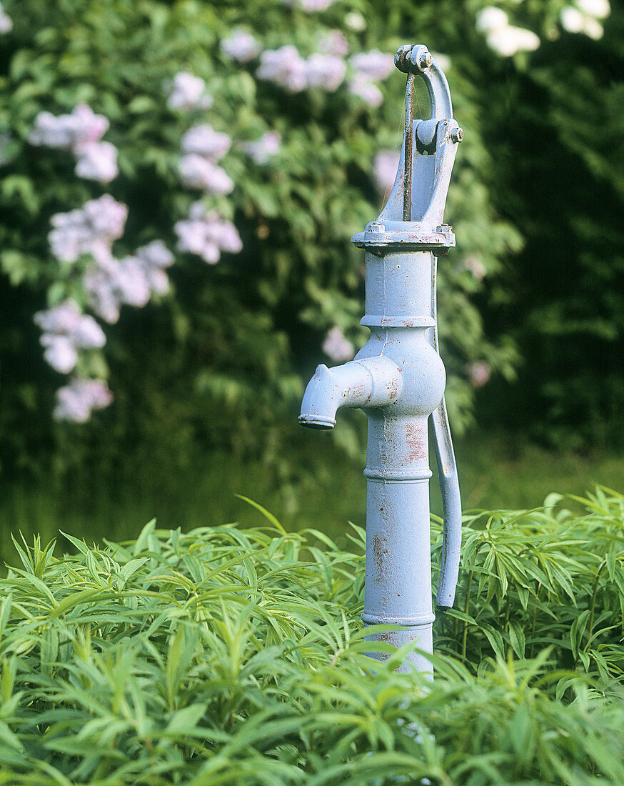 Old manual water pump in garden. Sweden, Scandinavia, Europe.
