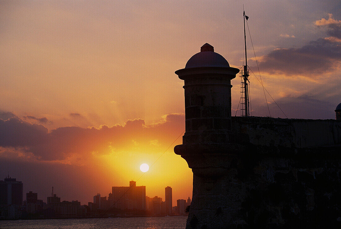 Fortress of El Morro at sunset and Havana in background. Cuba