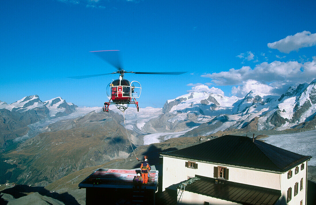 Alpine succour with helicopter. Matterhorn. Swiss Alps