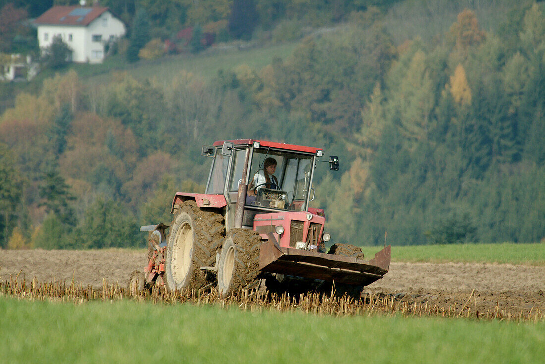 Tractor ploughing a field. Lower Bavaria. Germany.