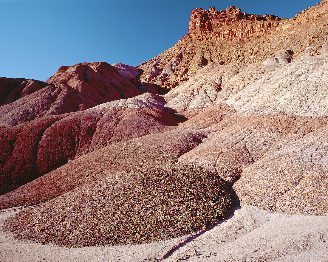 Layered badlands and red cliffs near Pahreah. Grand Staircase-Escalante National Monument, Utah USA