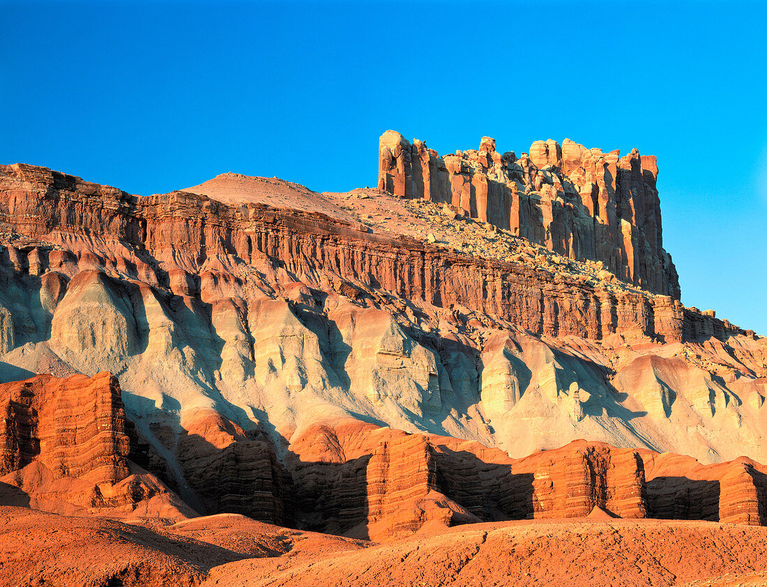The Castle rests atop layers of red cliffs and eroding formations. Capitol Reef National Park. Utah. USA