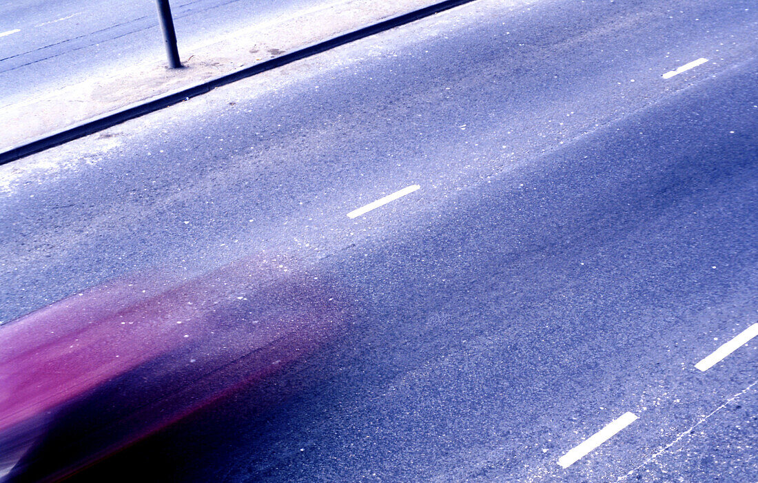 Car on main road, Neasden, London, UK